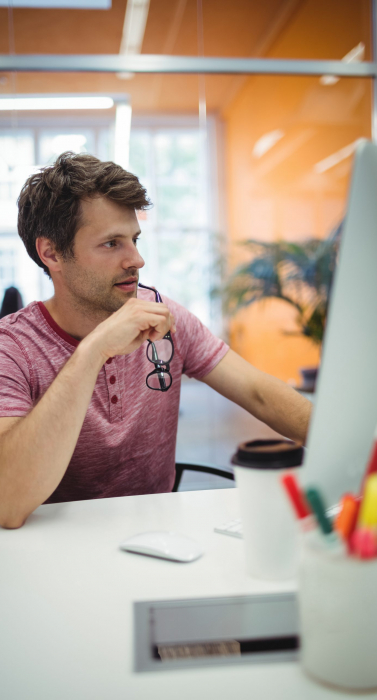 Male executive working at his desk in office